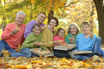 Fototapeta premium Happy family eat pizza together