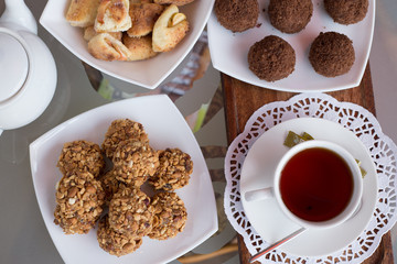 chocolate balls on the table close-up, different food, apple and walnut