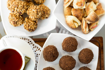 chocolate balls on the table close-up, different food, apple and walnut