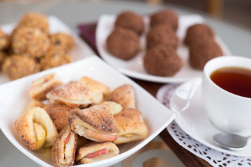 chocolate balls on the table close-up, different food, apple and walnut
