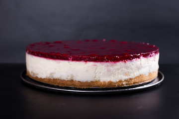berry cheesecake, on a black background, studio