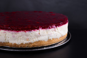 berry cheesecake, on a black background, studio