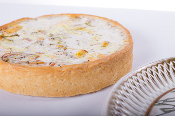 vegetable pie on a plate, white background, studio photo