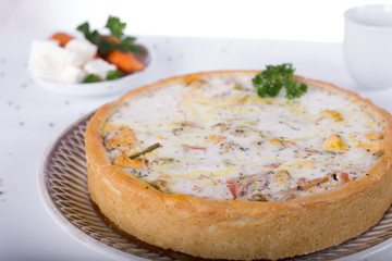 vegetable pie on a plate, white background, studio photo