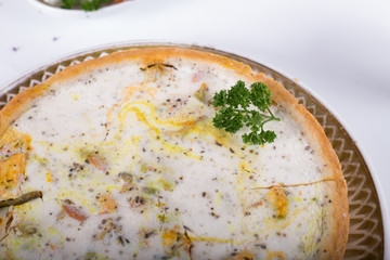 vegetable pie on a plate, white background, studio photo