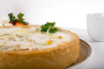 vegetable pie on a plate, white background, studio photo