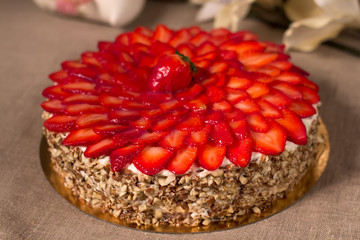 cake with strawberry cream, sliced berries, studio photo