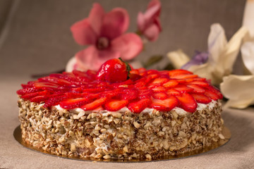 cake with strawberry cream, sliced berries, studio photo