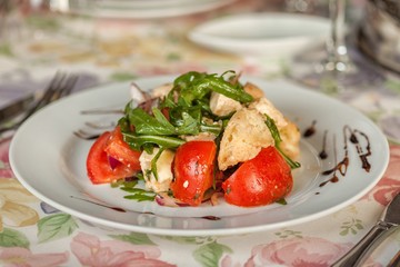Fresh vegetable salad with greens dressed with oil