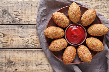 Kibbeh traditional middle eastern arabic lamb meat stuffed and bulgur kofta spicy meatball croquettes food on vintage wooden table background