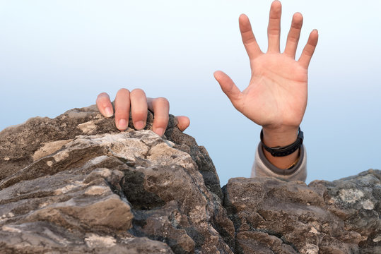 hand for help rock climbing