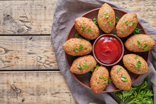 Kibbeh traditional middle eastern arabian lebanese restaurant lamb meat stuffed and bulgur kofta spicy meatball croquettes food on vintage wooden table background