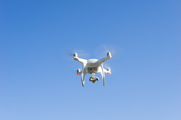 Drone flying in blue sky