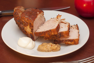 Roasted meat with spice, sauce and mustard in white plate. Beef