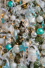 Christmas tree background decorated with balls, stars and lights