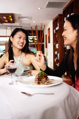 Two women eating in restaurant