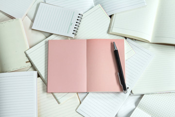 Manny empty notebook paper and note pad background with one pink