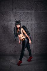 Black Angel. Beautiful model woman in underwear thin leather jac