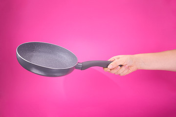 hand holding clean empty pan