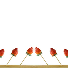 Strawberry skewer on white background.