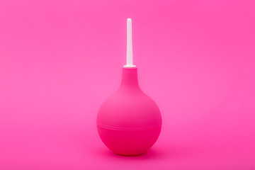 pink enema on a pink background