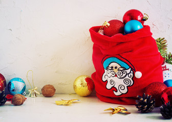 Christmas Composition red and yellow ballsin bag , snowflakes . Vintage style. toning