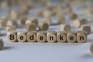 Bedenken - Holzwürfel mit Buchstaben