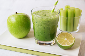 Healthy green celery smoothie in glass