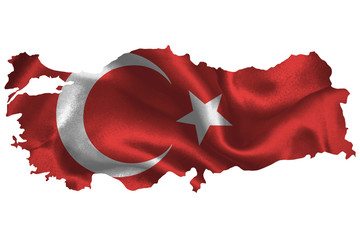 Map of Turkey with national flag on fabric surface.