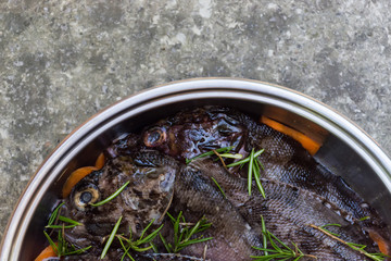 Black Sea scorpion fish or marine ruff with carrot and rosemary