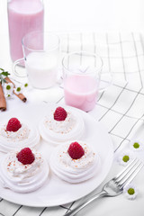 Still life with a group of meringue nest with whipped cream and