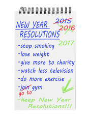 New year resolutions 2017 on notepad. List of improving intentions.