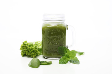 Healthy green smoothie and ingredients on white - superfoods, detox, diet, health, vegetarian food concept