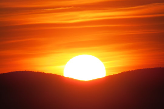 Smooth Orange Sunset Behind Two Mountains In Levis, Quebec, Canada.