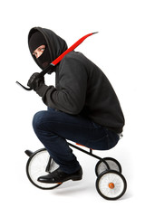 Robber going on children's bicycle