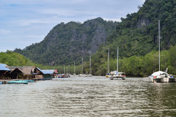 Malaysian village. boats with masts