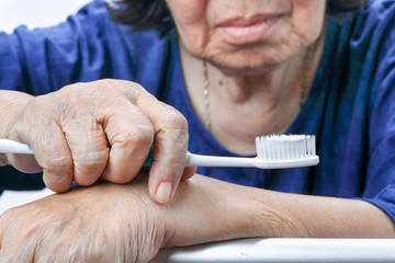 Asian elderly woman with a toothbrush. Dental health