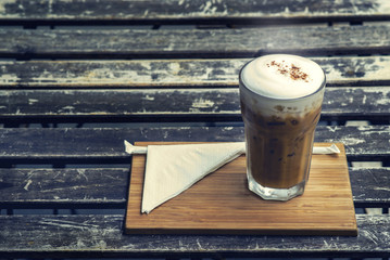 coffee with milk in mason jars on the table wood