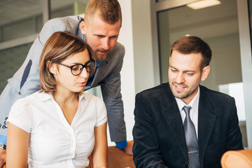 Group Of Businesspeople Meeting In Office