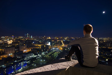 A man posing on the roof