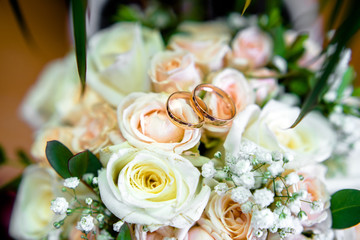 Engagement rings are on the wedding bukete.Soft focus