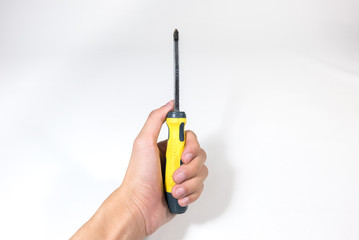 Man Hand holding screwdriver on white background - fix Concept