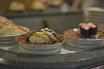 Sushi, in an automated conveyor restaurant in Tokyo, Japan
