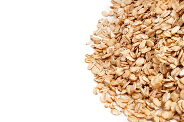 Golden oat flakes on white background. Close up, top view, high resolution product