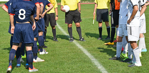 Soccer teams and referees before match