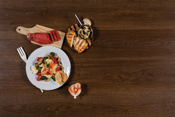 Fresh healthy salad on wooden table