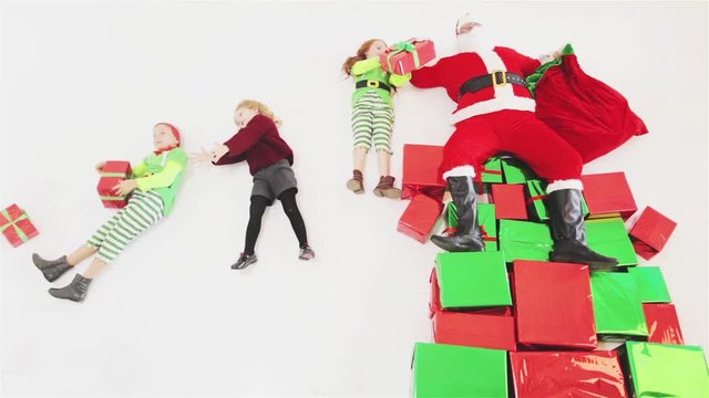 Santa's helpers working at North Pole. He Reading wishes list