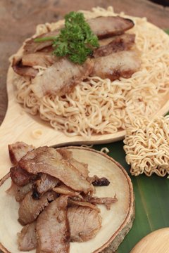Instant noodles at blanched with baked pork delicious.