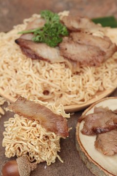 Instant noodles at blanched with baked pork delicious.