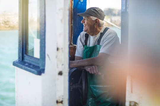Fisherman working on trawler